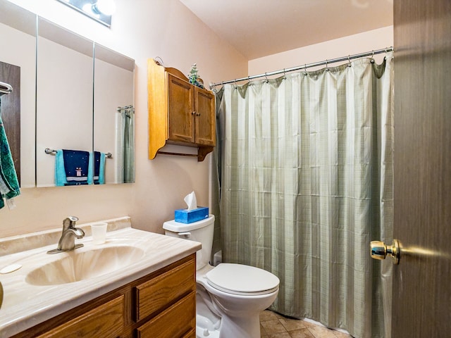 bathroom featuring tile patterned flooring, vanity, toilet, and curtained shower