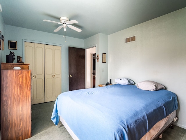 carpeted bedroom featuring ceiling fan and a closet