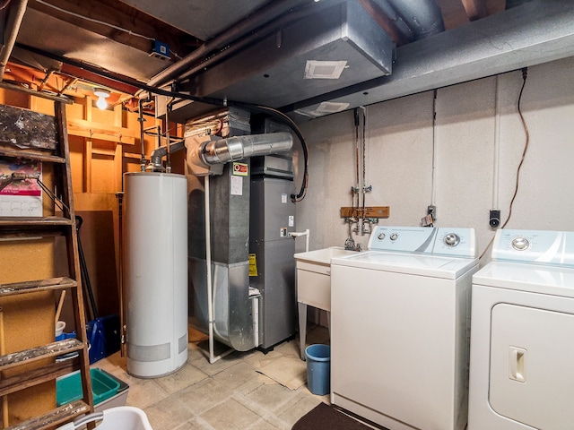 interior space with separate washer and dryer, heating unit, and gas water heater