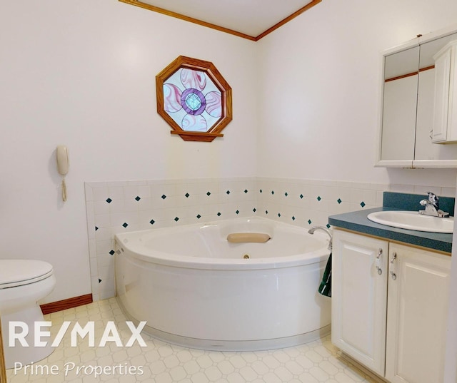 full bathroom with tile patterned floors, toilet, crown molding, a bath, and vanity