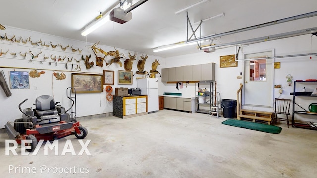 garage with a garage door opener and freestanding refrigerator