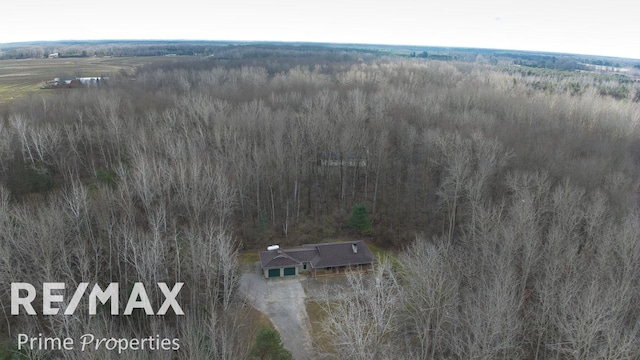 drone / aerial view with a view of trees