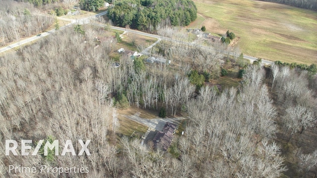 birds eye view of property with a rural view