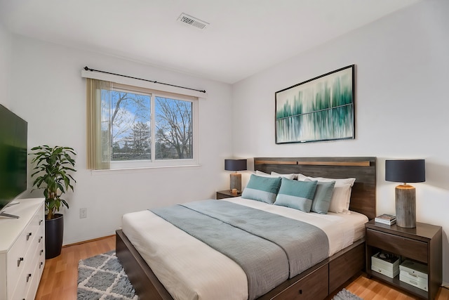 bedroom with light wood-type flooring