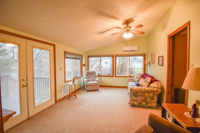 sunroom with french doors, an AC wall unit, ceiling fan, and lofted ceiling