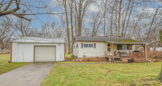 single story home featuring a front yard, a porch, a garage, and an outdoor structure