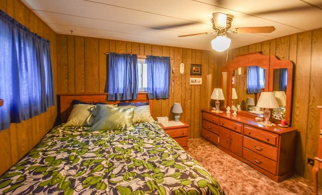 bedroom with ceiling fan and wooden walls