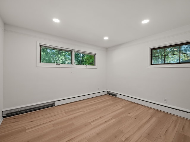 spare room featuring light hardwood / wood-style floors