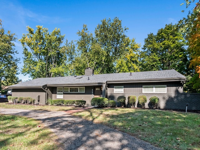 ranch-style house with a front yard