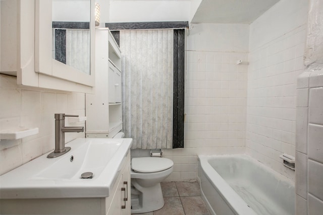 bathroom featuring tile patterned flooring, vanity, a bath, and tile walls