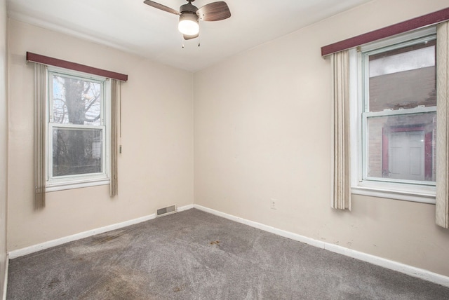 unfurnished room with carpet flooring and ceiling fan