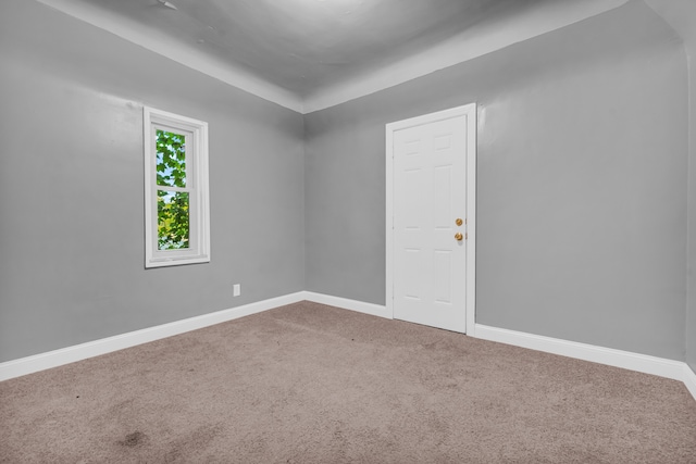 unfurnished room featuring carpet