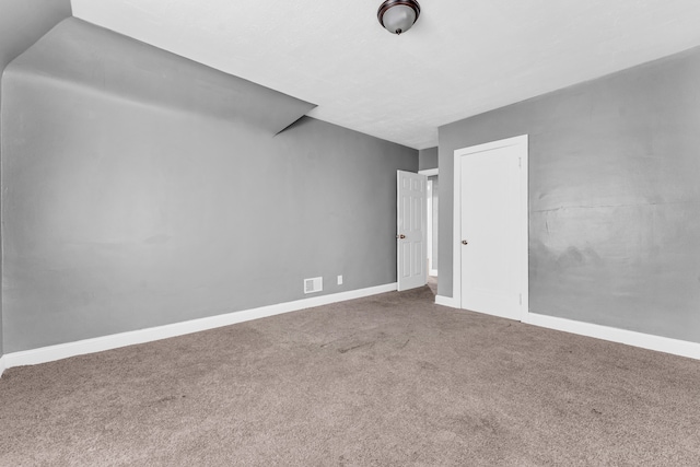 unfurnished room with carpet flooring