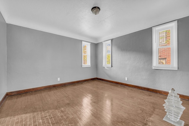 empty room featuring hardwood / wood-style floors