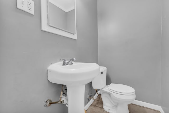 bathroom with tile patterned floors and toilet