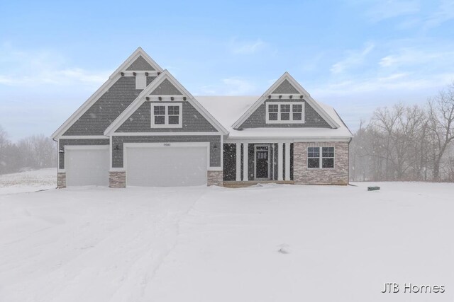 view of front facade featuring an attached garage and stone siding