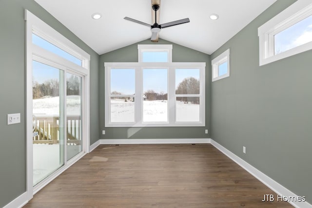 interior space featuring a ceiling fan, a wealth of natural light, and lofted ceiling