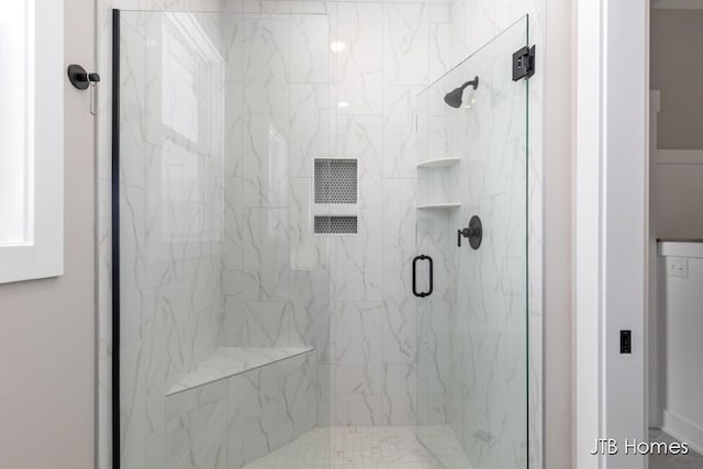 full bathroom with a shower stall