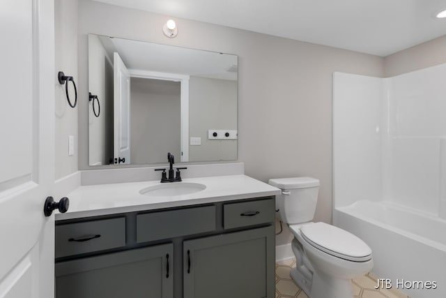 full bath featuring toilet, shower / bathing tub combination, and vanity