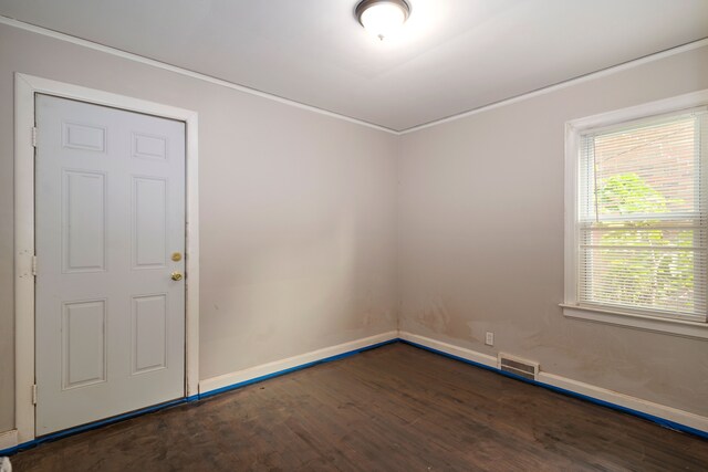 empty room with dark hardwood / wood-style flooring