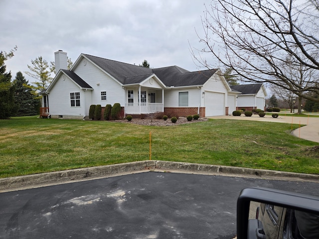 ranch-style house with a garage, covered porch, and a front lawn