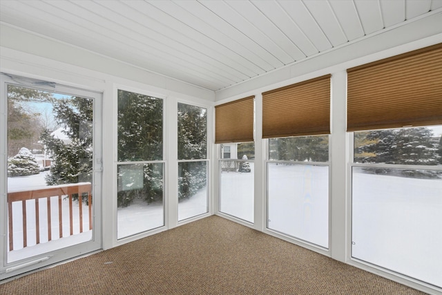 unfurnished sunroom with wooden ceiling