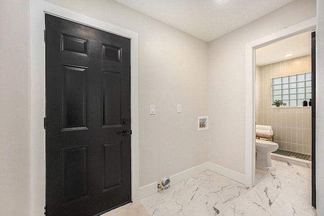 clothes washing area with laundry area, marble finish floor, washer hookup, and baseboards