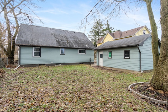 back of house with a yard