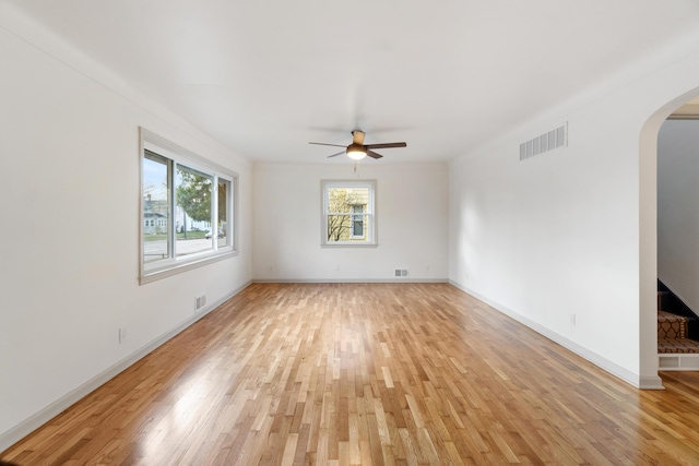 unfurnished room with light hardwood / wood-style flooring and ceiling fan