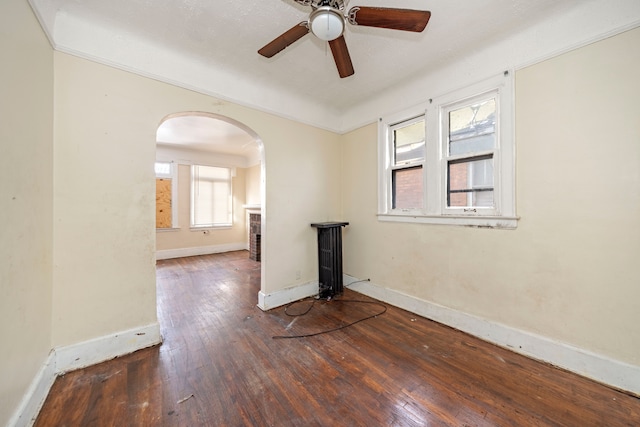 spare room with ceiling fan and dark hardwood / wood-style floors