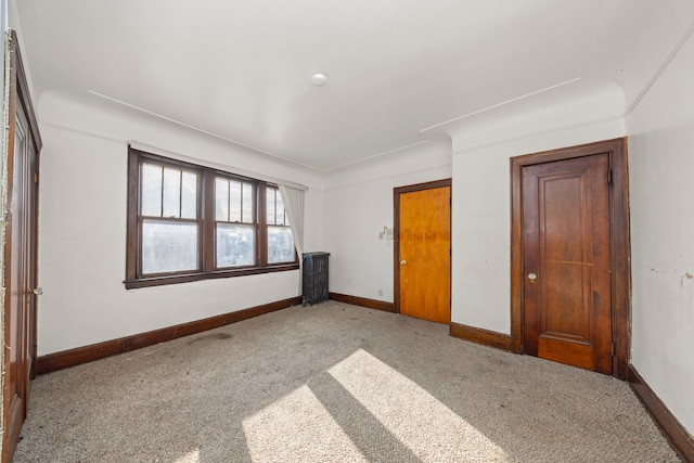 unfurnished bedroom with light colored carpet