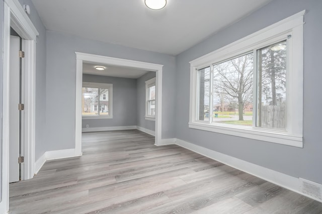 unfurnished room featuring light wood-type flooring