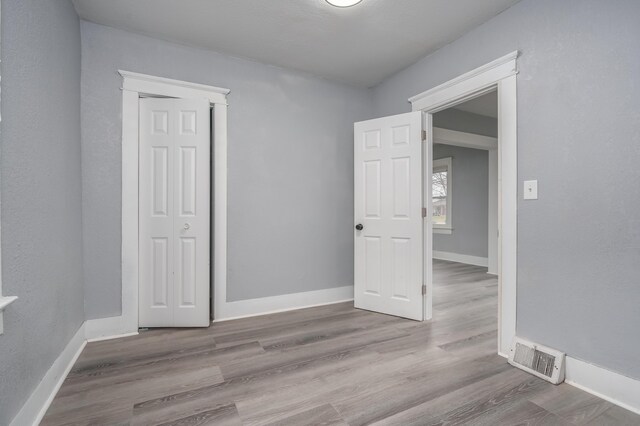 empty room featuring light hardwood / wood-style floors