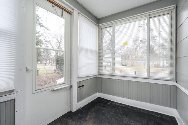 unfurnished sunroom with plenty of natural light