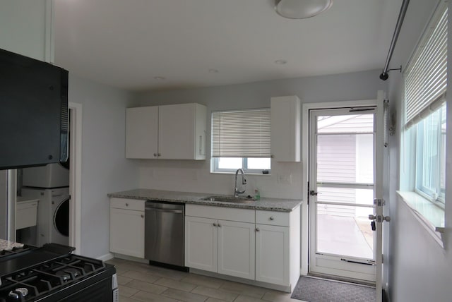 kitchen with stainless steel dishwasher, plenty of natural light, white cabinetry, and sink