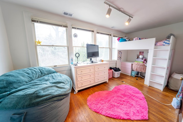 bedroom featuring wood-type flooring