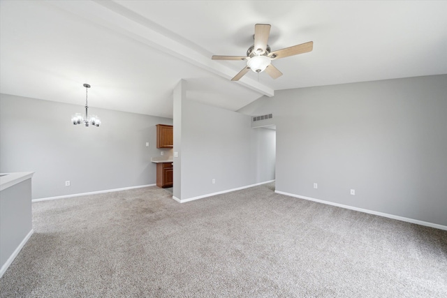 unfurnished living room with lofted ceiling with beams, ceiling fan with notable chandelier, and light colored carpet