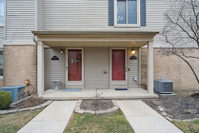 property entrance featuring central AC unit