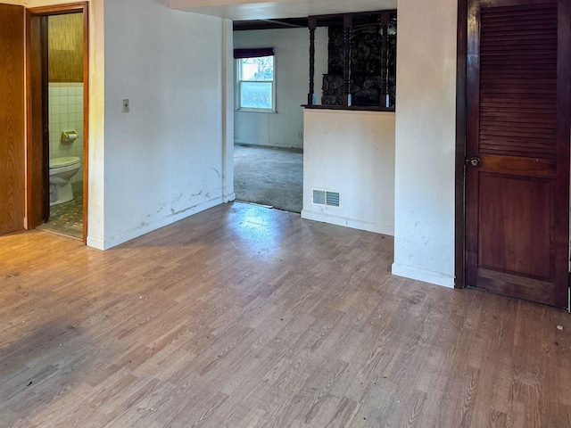 spare room featuring hardwood / wood-style floors