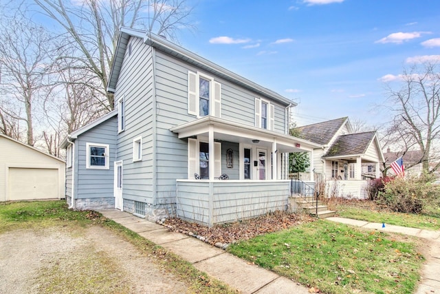 view of front of home with a porch, an outdoor structure, and a garage