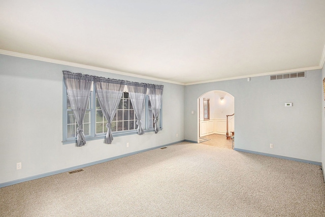 carpeted empty room with crown molding