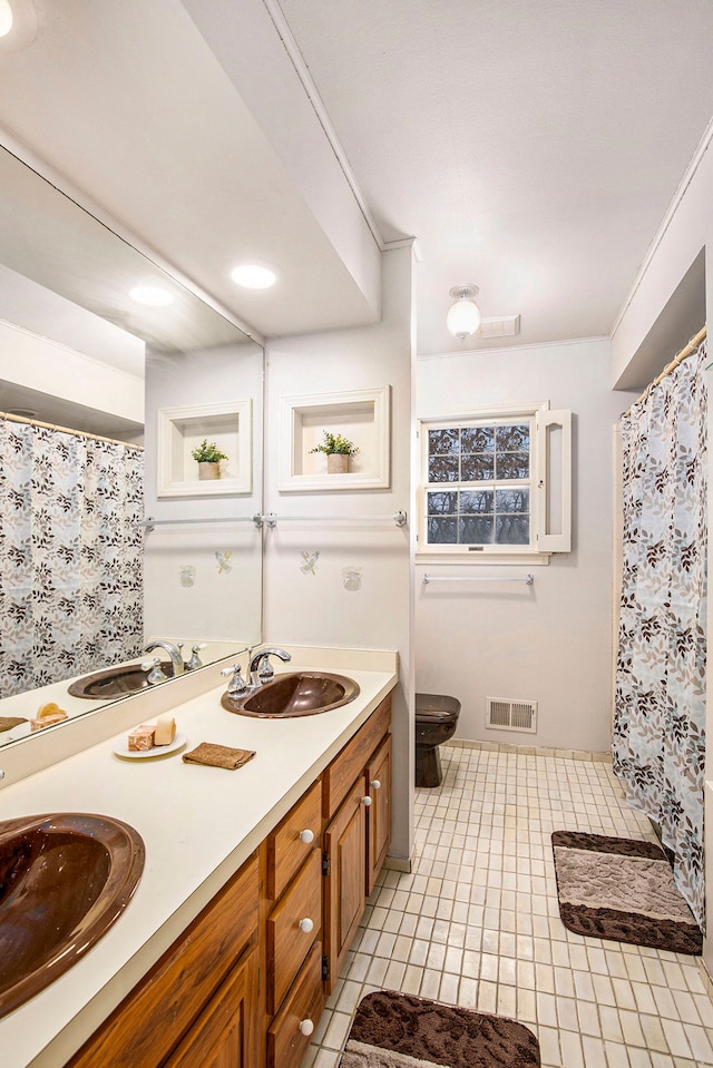 bathroom with a shower with curtain, tile patterned flooring, crown molding, toilet, and vanity