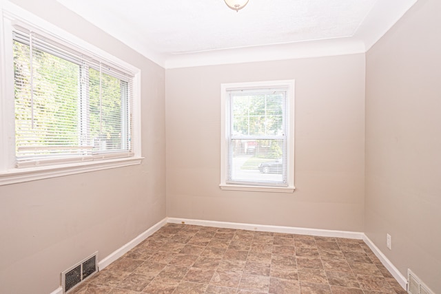 spare room with a textured ceiling