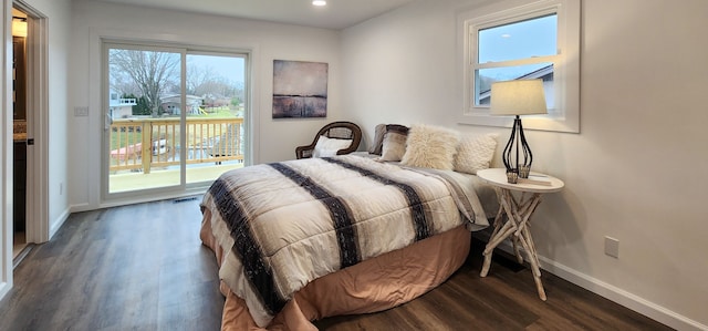 bedroom featuring access to outside and dark hardwood / wood-style floors