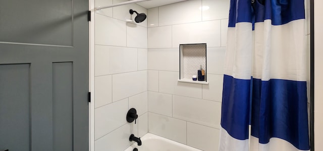 bathroom with shower / bath combination with curtain