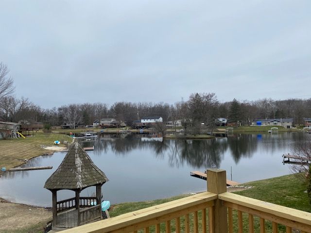 exterior space featuring a gazebo and a water view