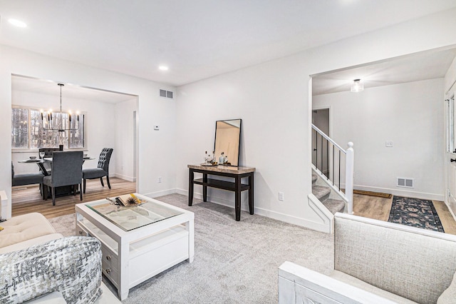 living room featuring hardwood / wood-style floors and a chandelier