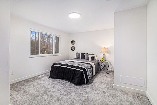 bedroom featuring light colored carpet