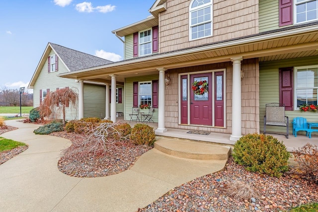 property entrance featuring a porch