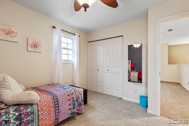 bedroom with carpet floors, a closet, and ceiling fan